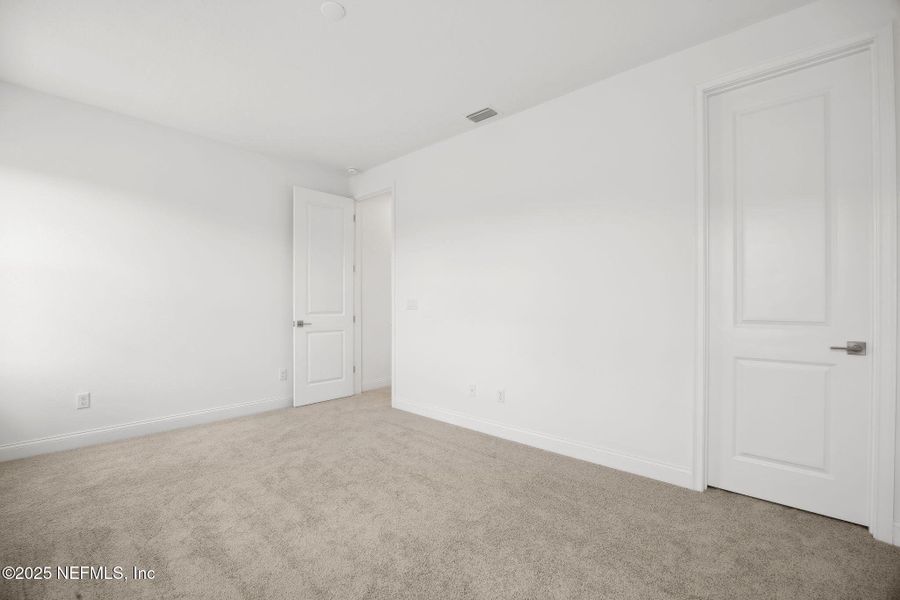 Spacious, unfurnished interior of a new home in Amelia National, Fernandina Beach (Image 26).