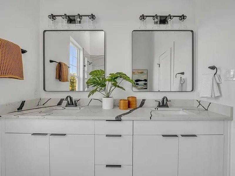 Bathroom featuring double vanity