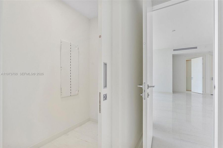 Spacious, unfurnished interior of a new home in Aston Martin Residences, Miami (Image 51).