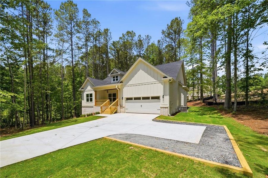 Front exterior of a new home in Autumn Brook, Canton, GA, highlighting curb appeal (Image 2). Front exterior of a new home in Autumn Brook, Canton, GA, highlighting curb appeal (Image 2).