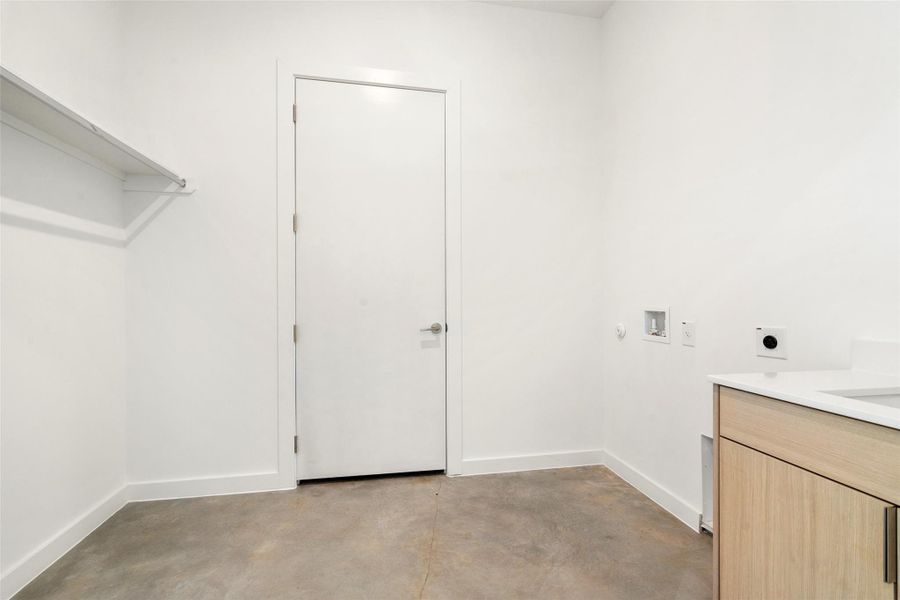 Laundry area featuring washer hookup and electric dryer hookup