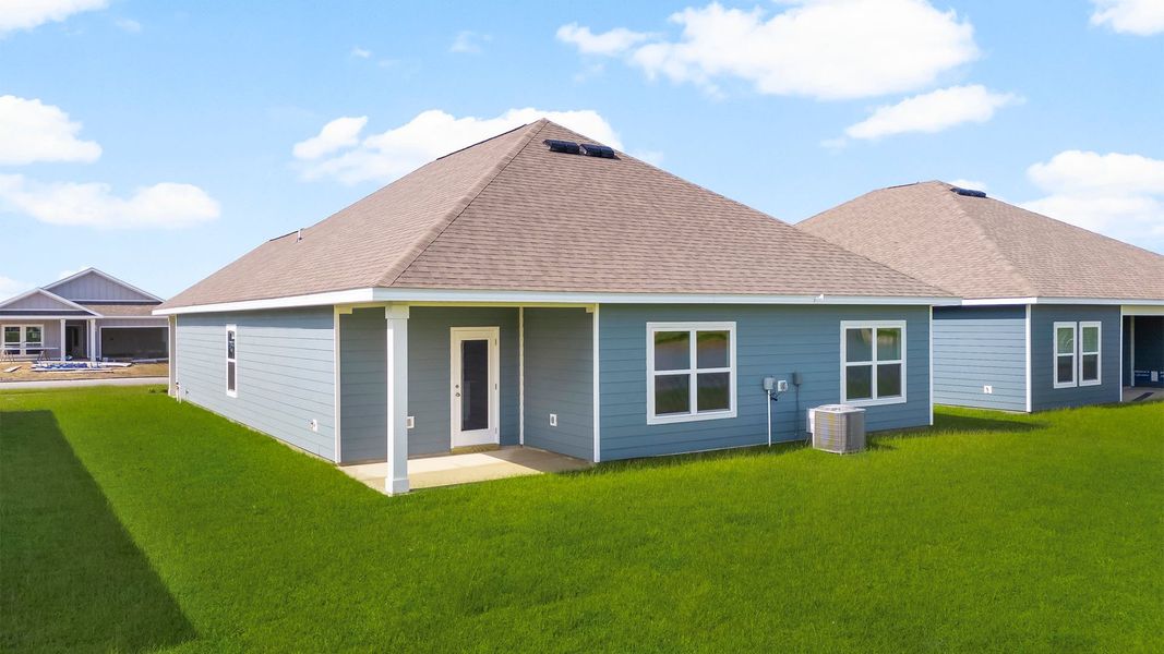 Front exterior of a new home in Hodges Bayou Plantation, Panama City, FL, highlighting curb appeal (Image 18). Front exterior of a new home in Hodges Bayou Plantation, Panama City, FL, highlighting curb appeal (Image 18).