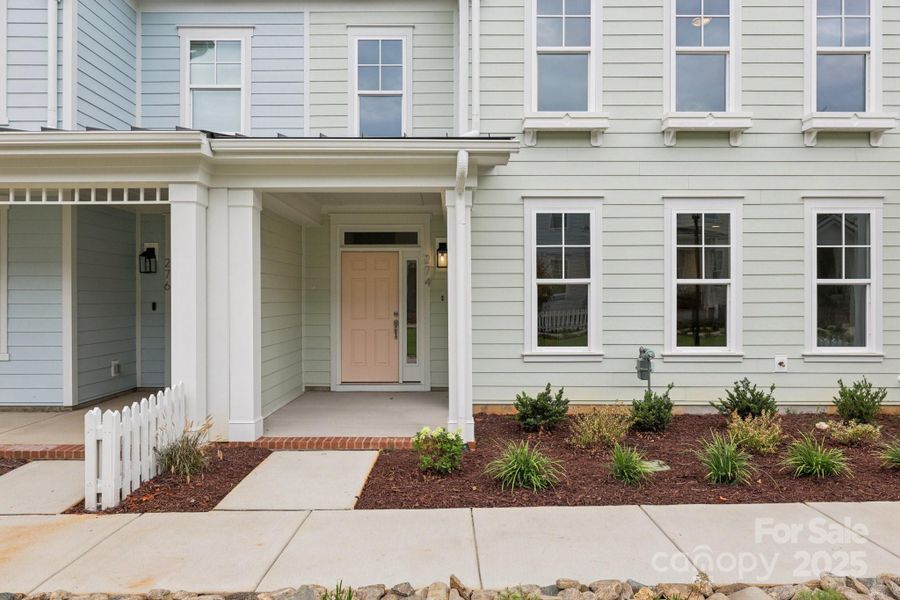 Exterior details and patio area of a home in Walk23, Huntersville (Image 3).