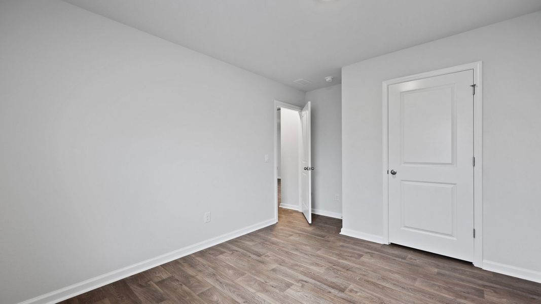 Representative unfurnished interior of a home built from the DOWNING by D.R. Horton in Saltgrass Landing, Winnabow (Image 26).