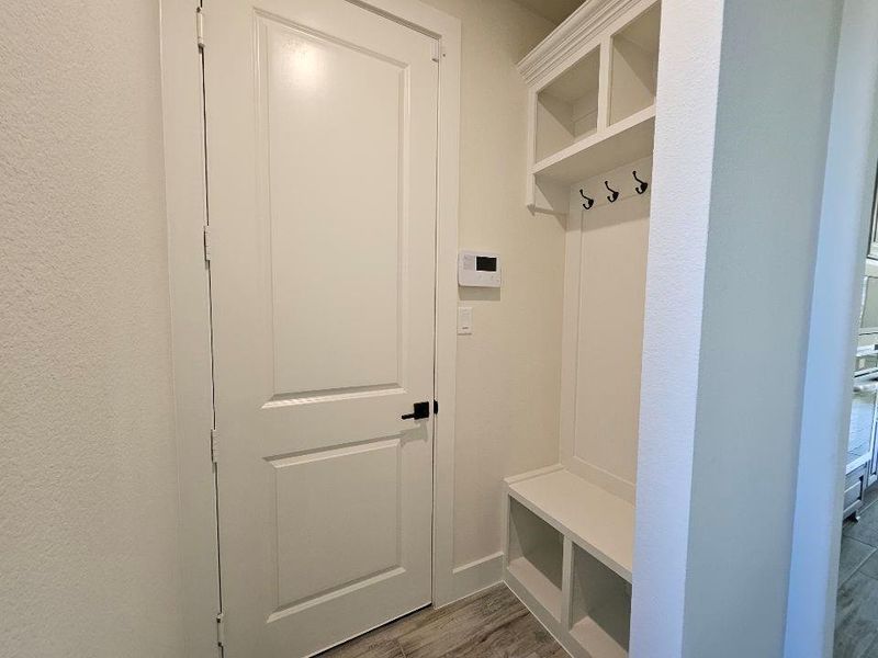 Mudroom with light wood-type flooring