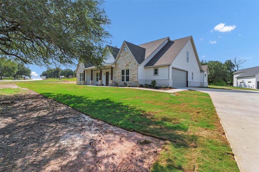 Front exterior of a new home in , Granbury, TX, highlighting curb appeal (Image 2). Front exterior of a new home in , Granbury, TX, highlighting curb appeal (Image 2).