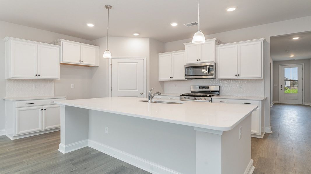 Representative furnished interior of a home built from the DARBY by D.R. Horton in Spring View Landing, Loris (Image 5).