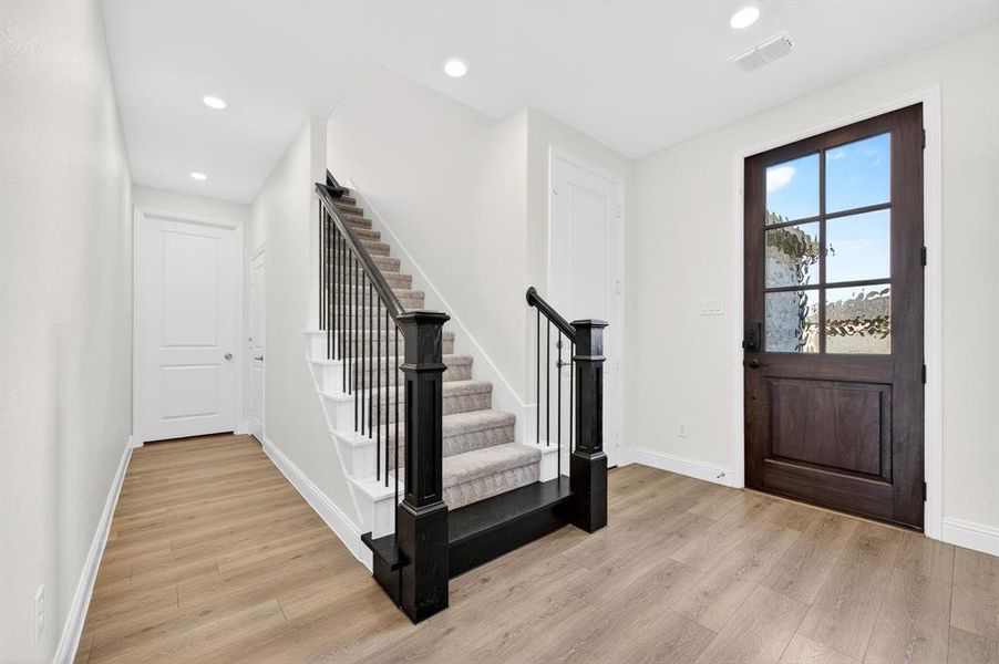 Hallway goes to laundry room and garage