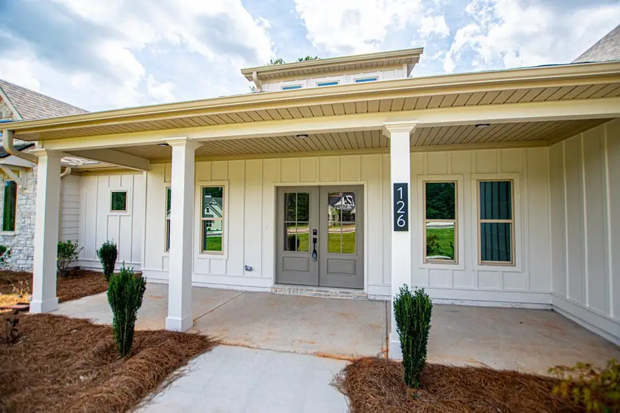 Exterior details and patio area of a home in WOODMONT RESERVE, Roopville (Image 41).