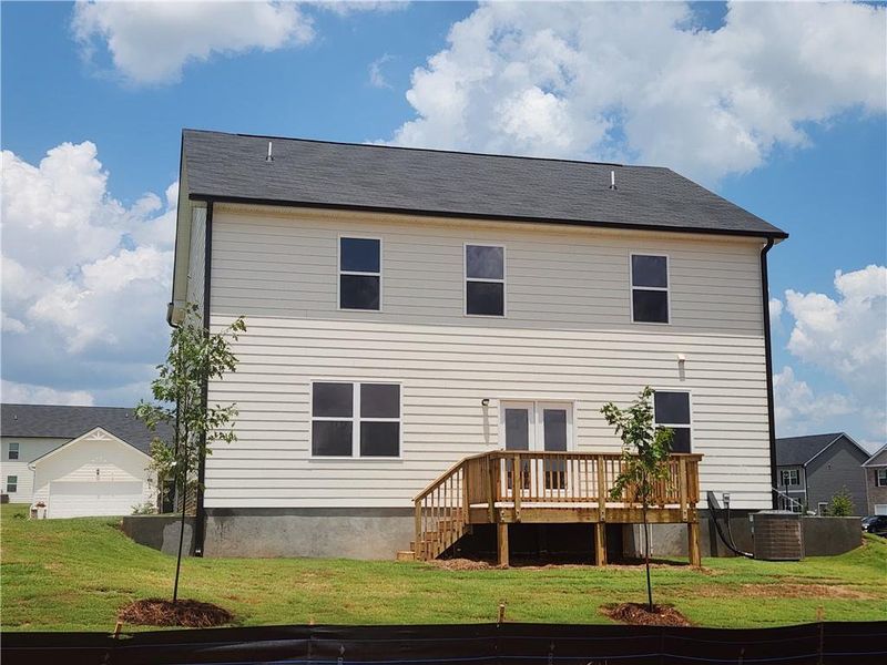 Front exterior of a new home in Locust Grove Station - Cedar Ridge, Locust Grove, GA, highlighting curb appeal (Image 21).