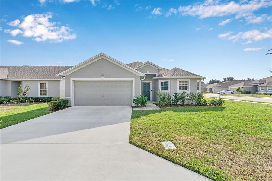 Front exterior of a new home in Thompson Preserve, Bartow, FL, highlighting curb appeal (Image 1). Front exterior of a new home in Thompson Preserve, Bartow, FL, highlighting curb appeal (Image 1).