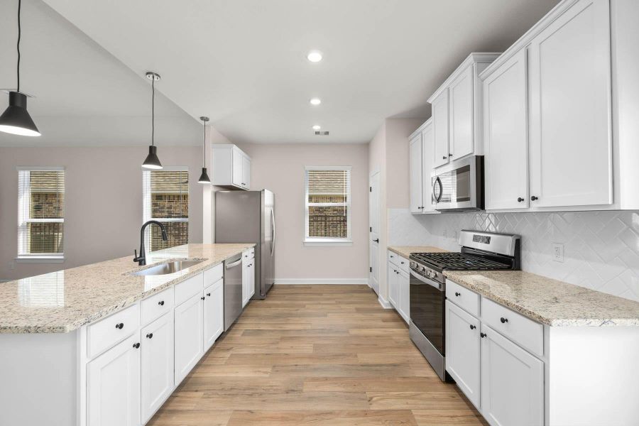 Furnished interior view inside a new home in Sunterra, Katy (Image 3).