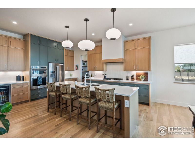 Custom built cabinets, quartz countertops, slow close drawers, custom range hood and gas range Custom built cabinets, quartz countertops, slow close drawers, custom range hood and gas range