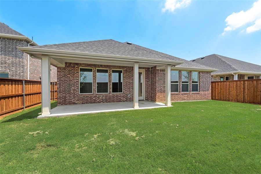 Front exterior of a new home in Spiritas Ranch, Little Elm, TX, highlighting curb appeal (Image 2). Front exterior of a new home in Spiritas Ranch, Little Elm, TX, highlighting curb appeal (Image 2).