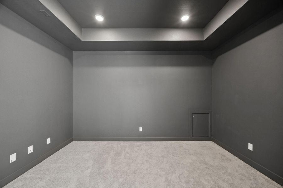 This property includes a media room adjacent to the game room featuring stylish tray ceilings, recessed lighting and wiring for surround sound.