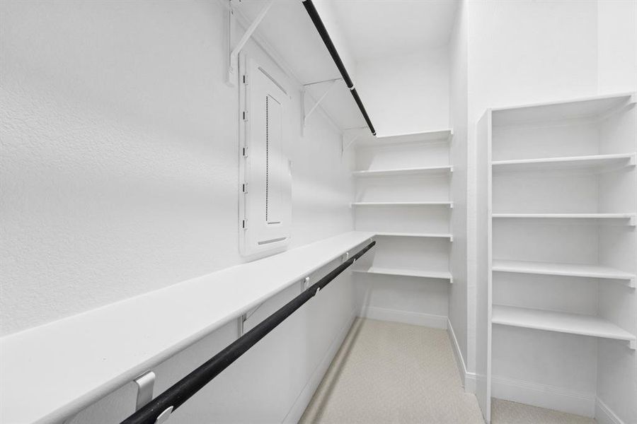 Walk in closet with light carpet Walk in closet with light carpet