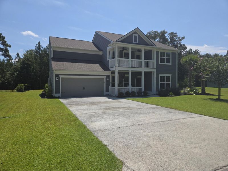 Front exterior of a new home in Sea Island Preserve, Johns Island, SC, highlighting curb appeal (Image 22).