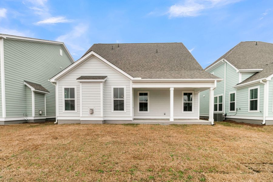 Exterior details and patio area of a home in Tidewater at Lakes of Cane Bay, Summerville (Image 27).
