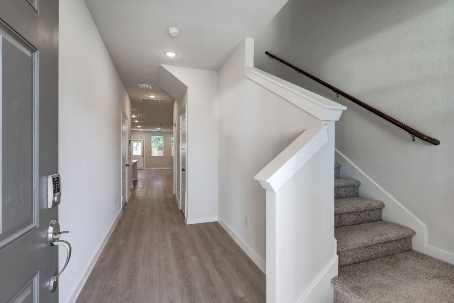 A hallway with white walls. A hallway with white walls.