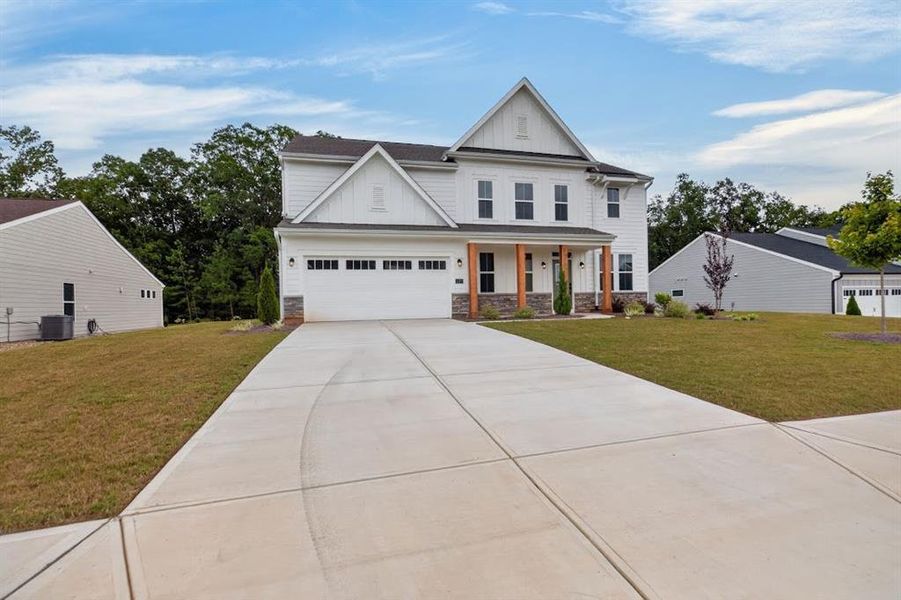 Front exterior of a new home in Pickens Bluff, Hiram, GA, highlighting curb appeal (Image 30).