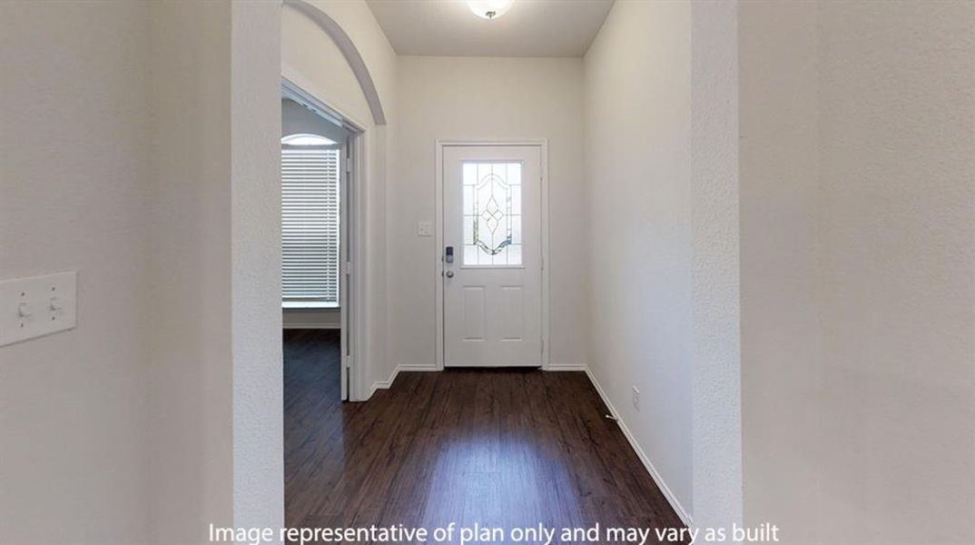 Entryway featuring wood finished floors and arched walkways Entryway featuring wood finished floors and arched walkways