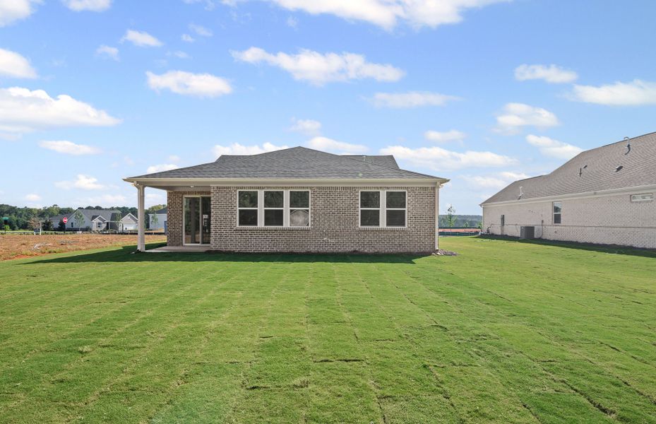 Exterior details and patio area of a home in Overland, Locust Grove (Image 4).