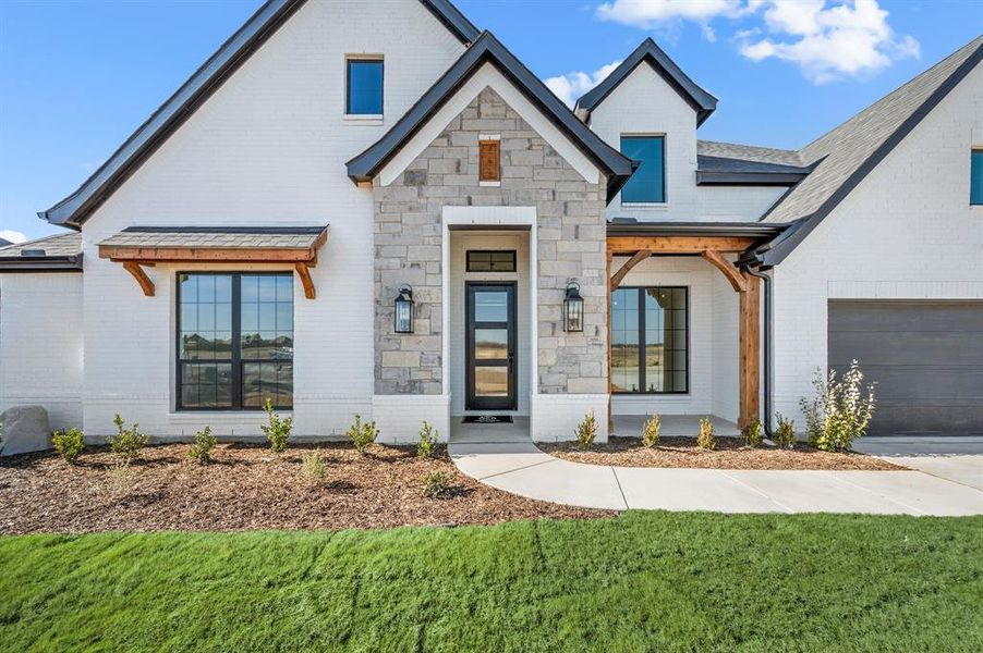 Front exterior of a new home in Settlers Glen, New Fairview, TX, highlighting curb appeal (Image 24).