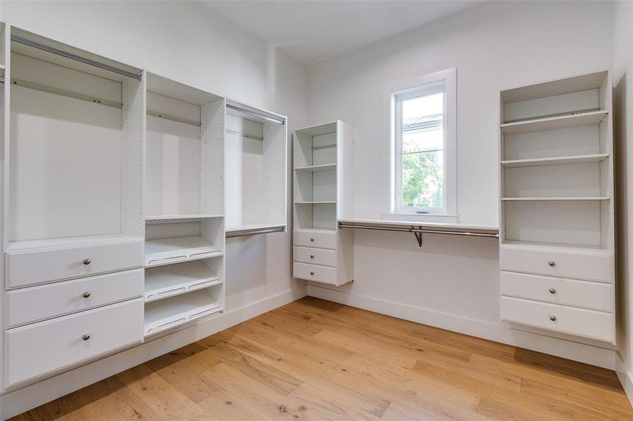 Spacious closet featuring light wood-type flooring