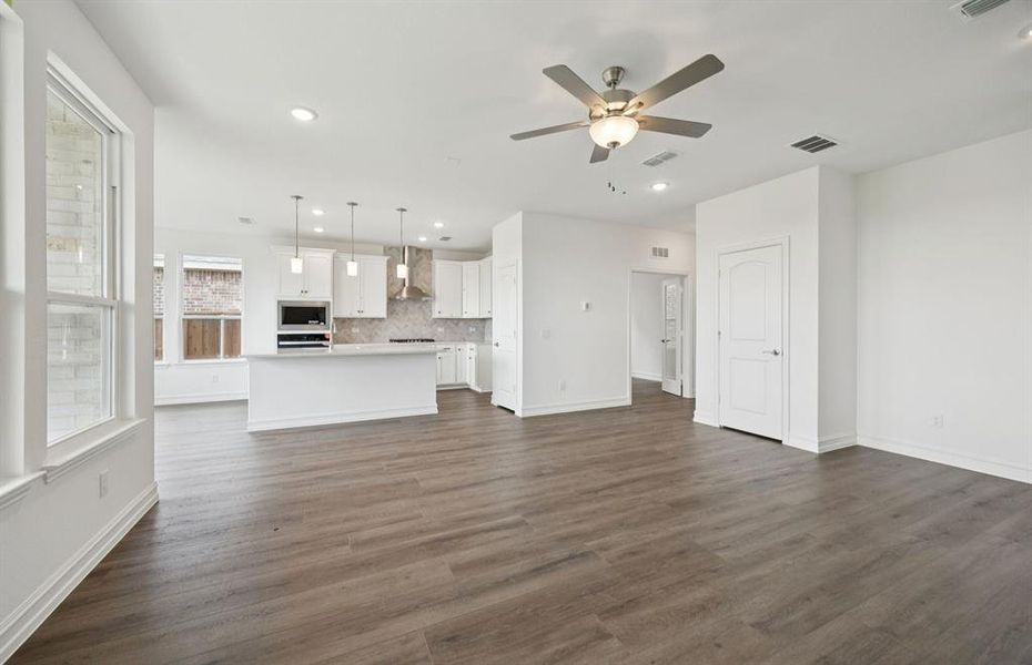 Expansive gathering room bathed in natural sunlight *Real home pictured Expansive gathering room bathed in natural sunlight *Real home pictured