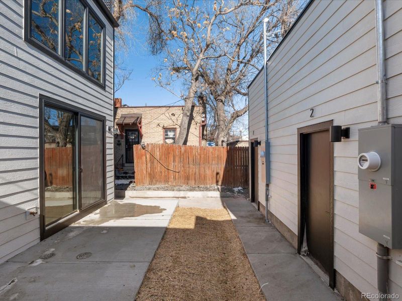 Courtyard for Unit 2 will be enclosed with fence prior to close