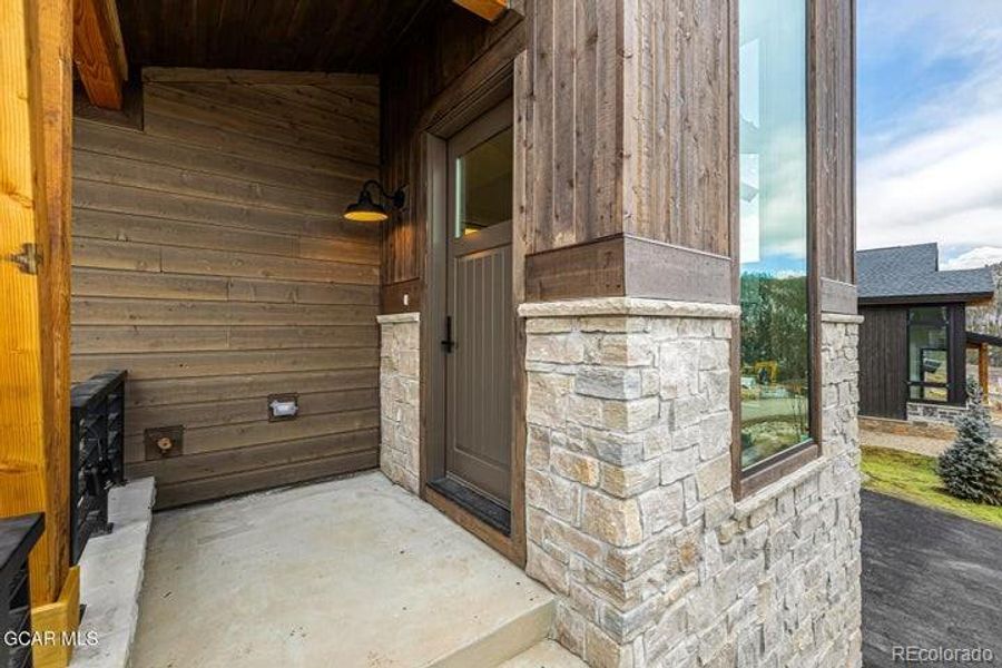 Exterior details and patio area of a home in , Granby (Image 3).