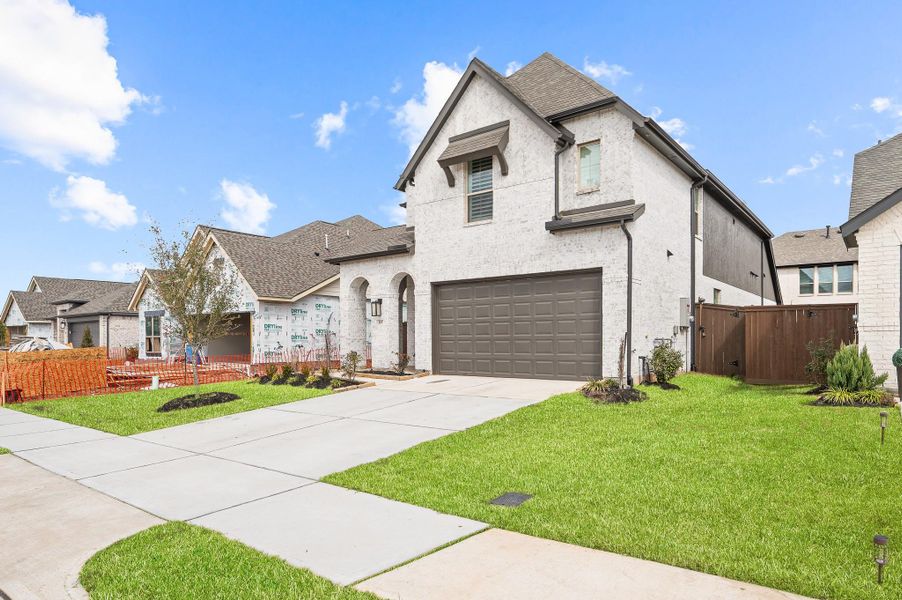Front exterior of a new home in Brookewater, Rosenberg, TX, highlighting curb appeal (Image 28).