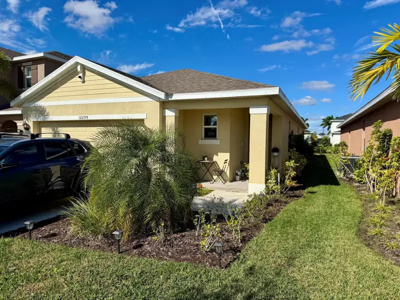 Front exterior of a new home in , Port St. Lucie, FL, highlighting curb appeal (Image 2). Front exterior of a new home in , Port St. Lucie, FL, highlighting curb appeal (Image 2).