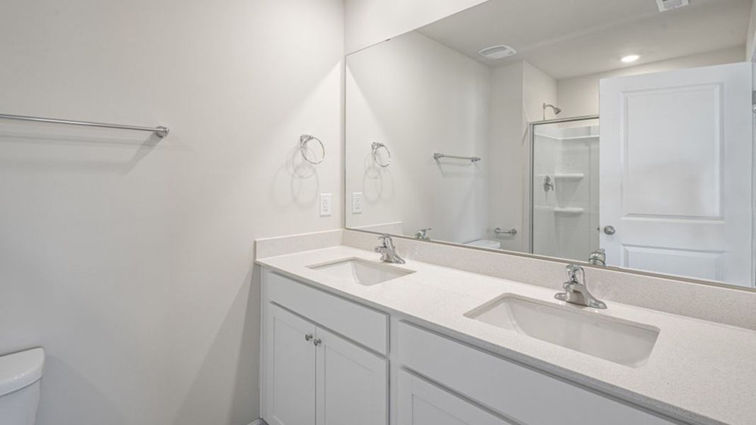 Representative furnished interior of a home built from the FREEPORT by D.R. Horton in River's Edge, Mayodan (Image 6).