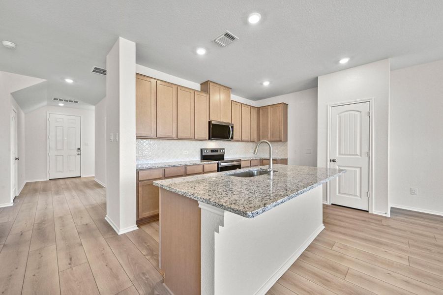 Furnished interior view inside a new home in Mustang Valley, Manor (Image 8). Furnished interior view inside a new home in Mustang Valley, Manor (Image 8).