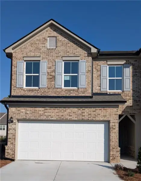 Front exterior of a new home in , Loganville, GA, highlighting curb appeal (Image 1). Front exterior of a new home in , Loganville, GA, highlighting curb appeal (Image 1).
