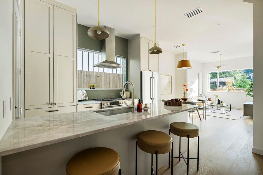 Kitchen wood finished floors, and a kitchen bar