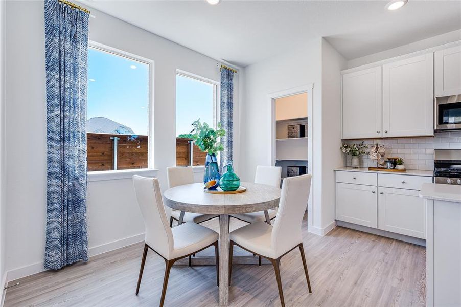 Dining area with light hardwood / wood-style floors