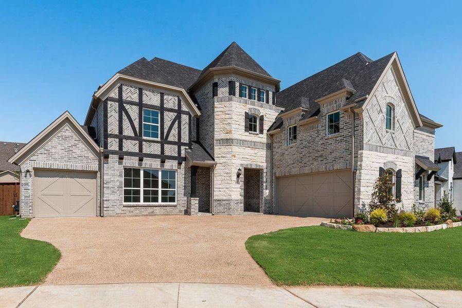 Front exterior of a new home in South Pointe, Mansfield, TX, highlighting curb appeal (Image 1).