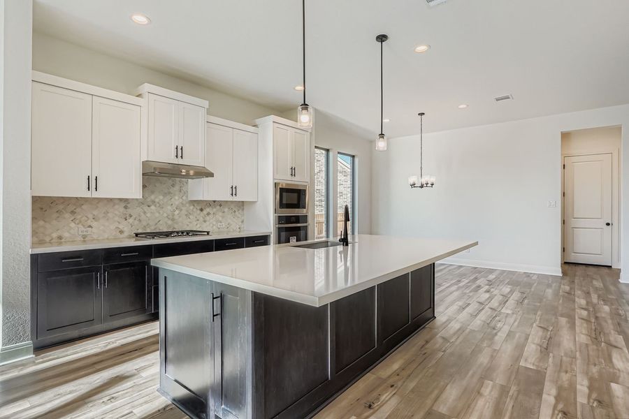 Furnished interior view inside a new home in 6 Creeks, Kyle (Image 3).