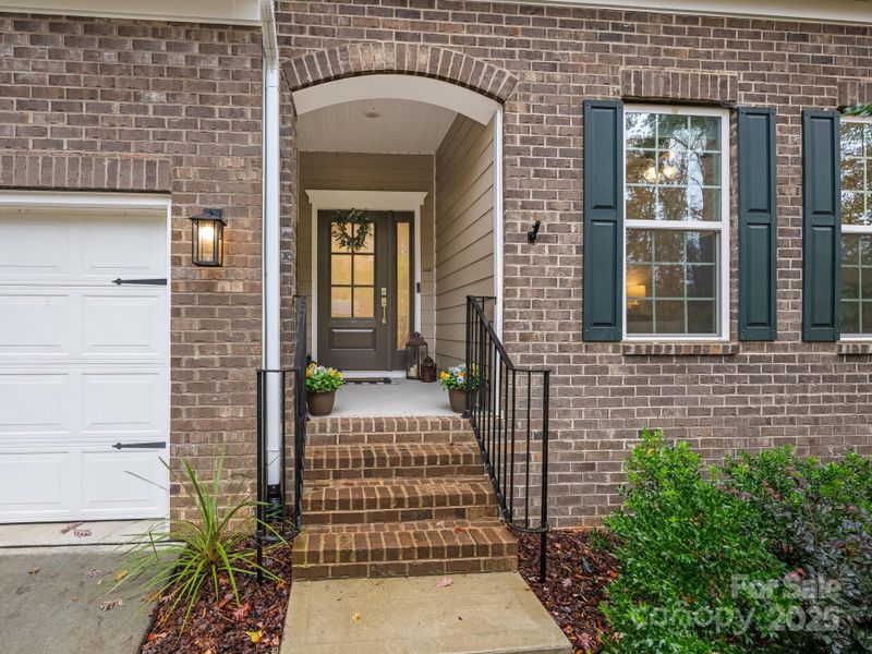 Exterior details and patio area of a home in Estates at Arlington Woods, Mint Hill (Image 3).