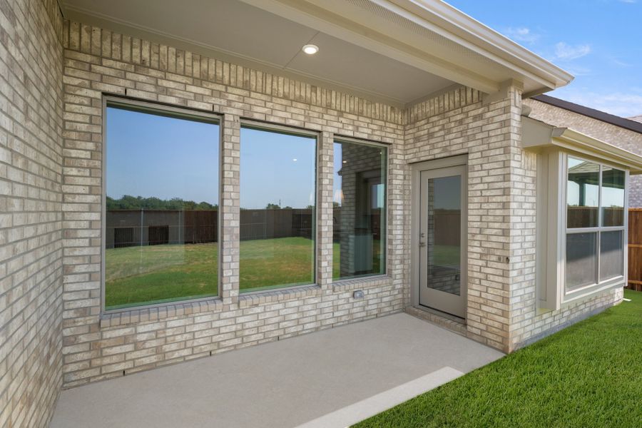 Exterior details and patio area of a home in Meadow Park at The Meadows, Ponder (Image 3). Exterior details and patio area of a home in Meadow Park at The Meadows, Ponder (Image 3).