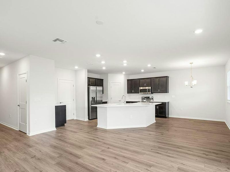 This move-in-ready home features a sunny open layout with low-maintenance LVP flooring.