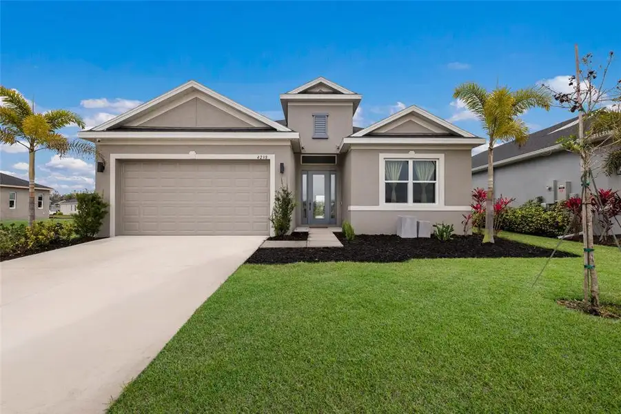 Front exterior of a new home in , Parrish, FL, highlighting curb appeal (Image 1). Front exterior of a new home in , Parrish, FL, highlighting curb appeal (Image 1).