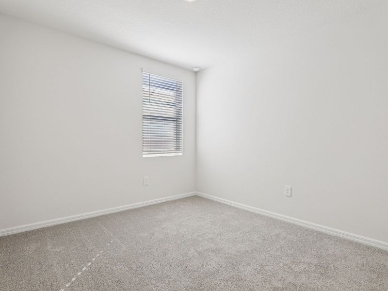 Spacious, unfurnished interior of a new home in Lake Deer Estates - Signature Series, Poinciana (Image 12).