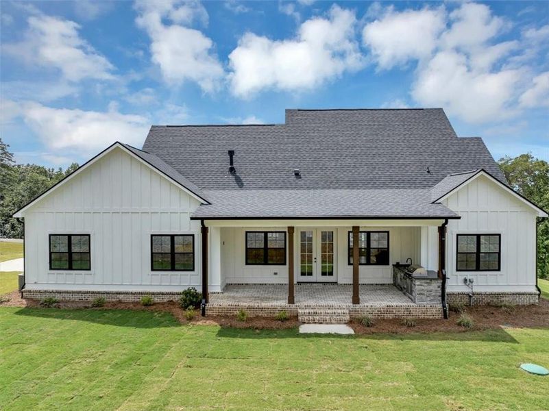 Front exterior of a new home in , Ball Ground, GA, highlighting curb appeal (Image 1).
