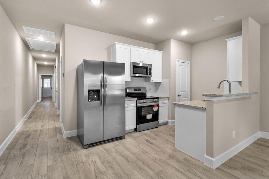 Furnished interior view inside a new home in , Willis (Image 10).