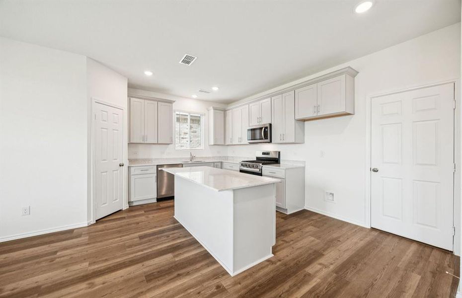 *floorplan representation, not actual home - Spacious kitchen with eat-in bartop island