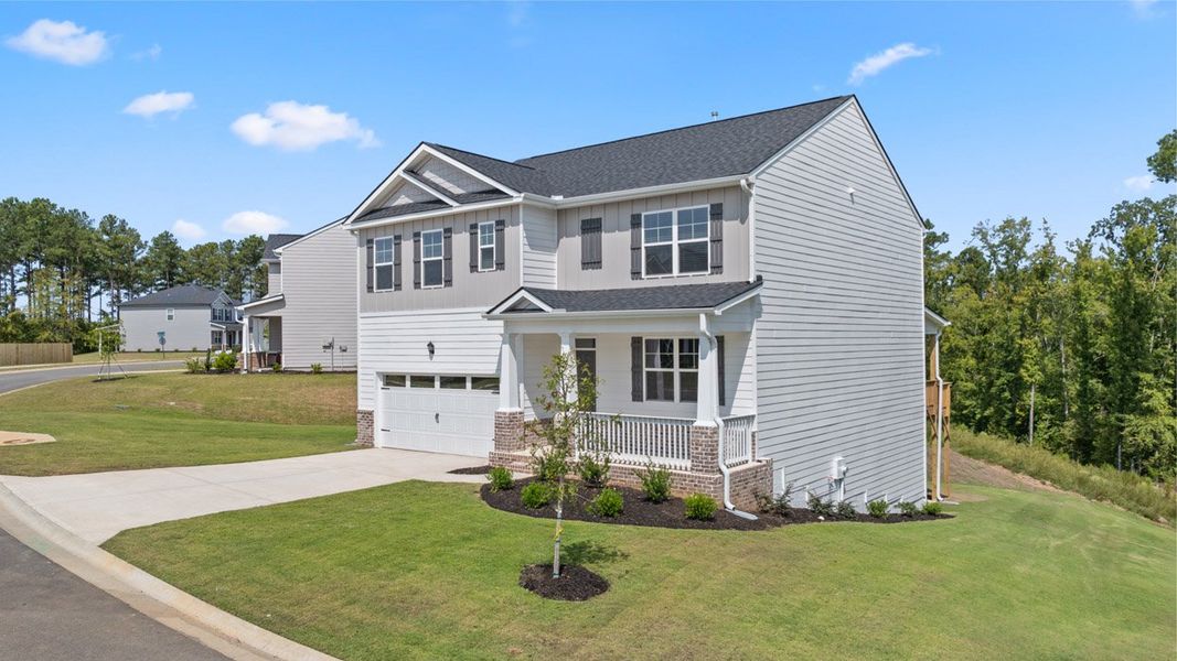 Front exterior of a new home in Southwind Village, Evans, GA, highlighting curb appeal (Image 2). Front exterior of a new home in Southwind Village, Evans, GA, highlighting curb appeal (Image 2).