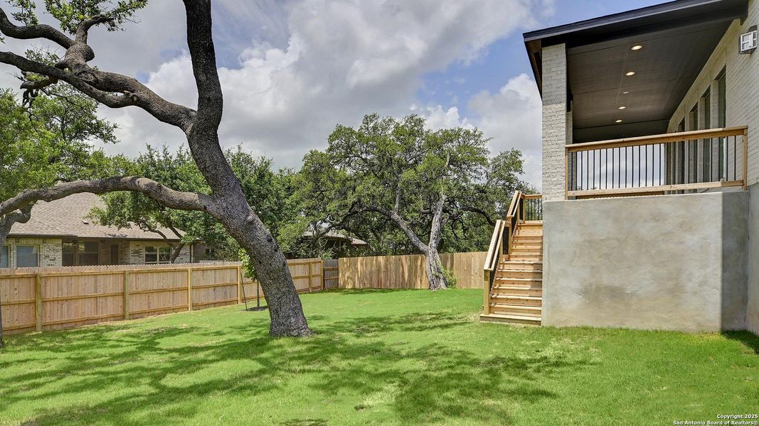 Front exterior of a new home in Ranches At Creekside 55', Boerne, TX, highlighting curb appeal (Image 18). Front exterior of a new home in Ranches At Creekside 55', Boerne, TX, highlighting curb appeal (Image 18).